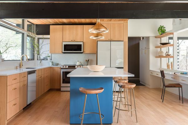 The team eliminated the original front door, making the mudroom / side entry the main entry. This made better use of the small floor plan and allowed the kitchen to expand.